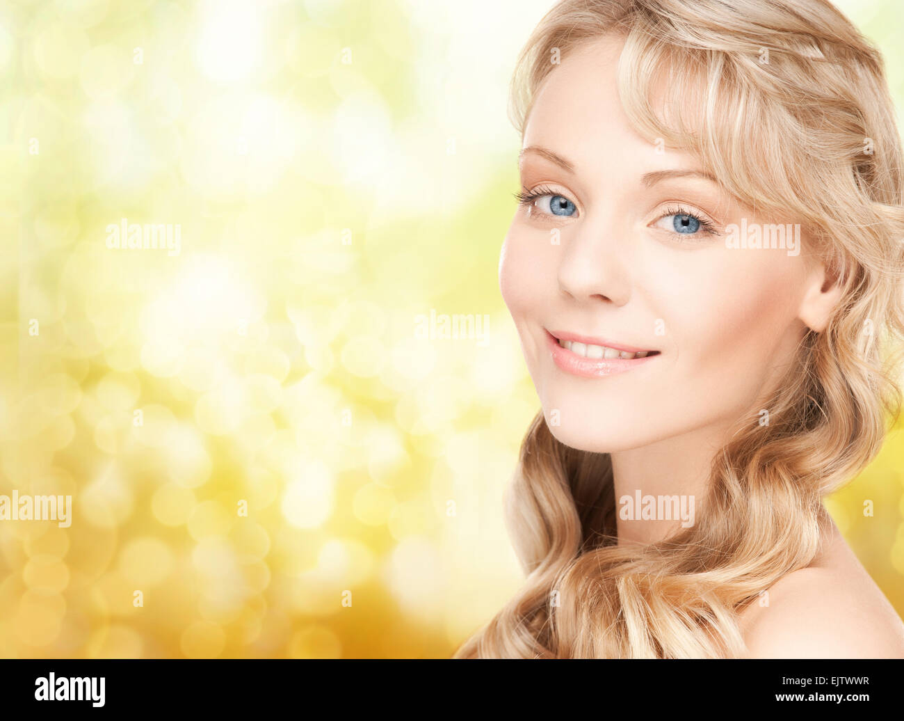 beautiful young woman face with long wavy hair Stock Photo - Alamy
