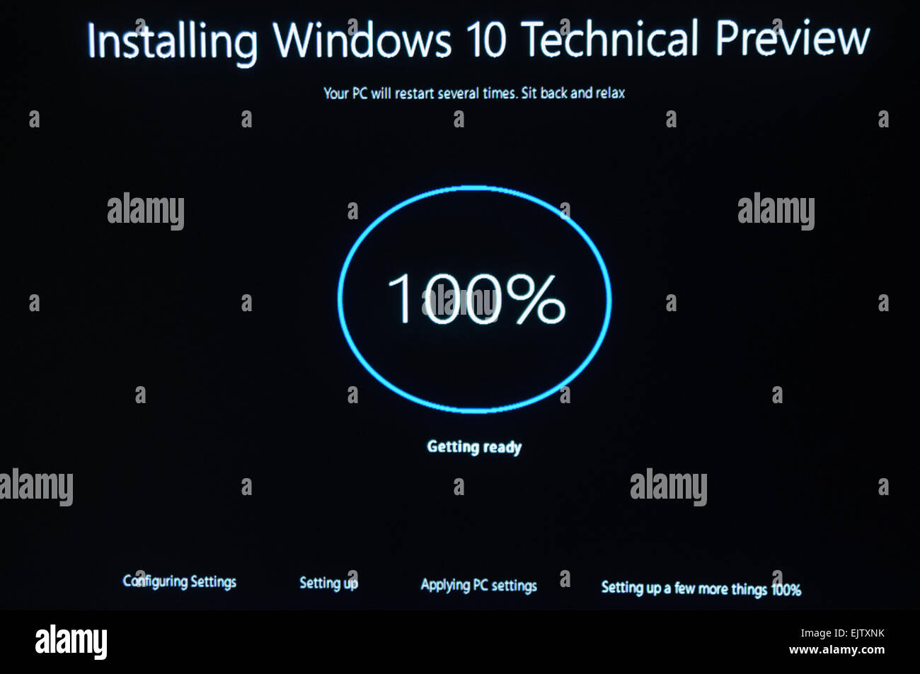 Installing Windows 10 Technical Preview, a public beta release. Stock Photo