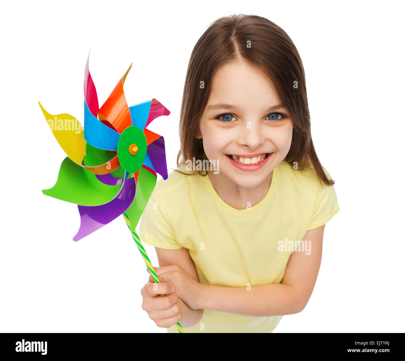 smiling child with colorful windmill toy Stock Photo