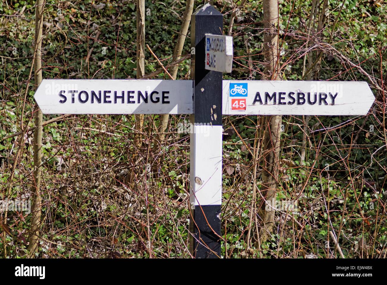 Three way road sign depicting way to Stonehenge Amesbury Wiltshire
