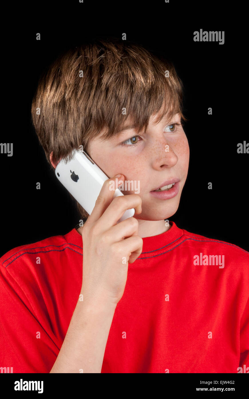 Young Boy Talking on a Apple Iphone 3G Stock Photo