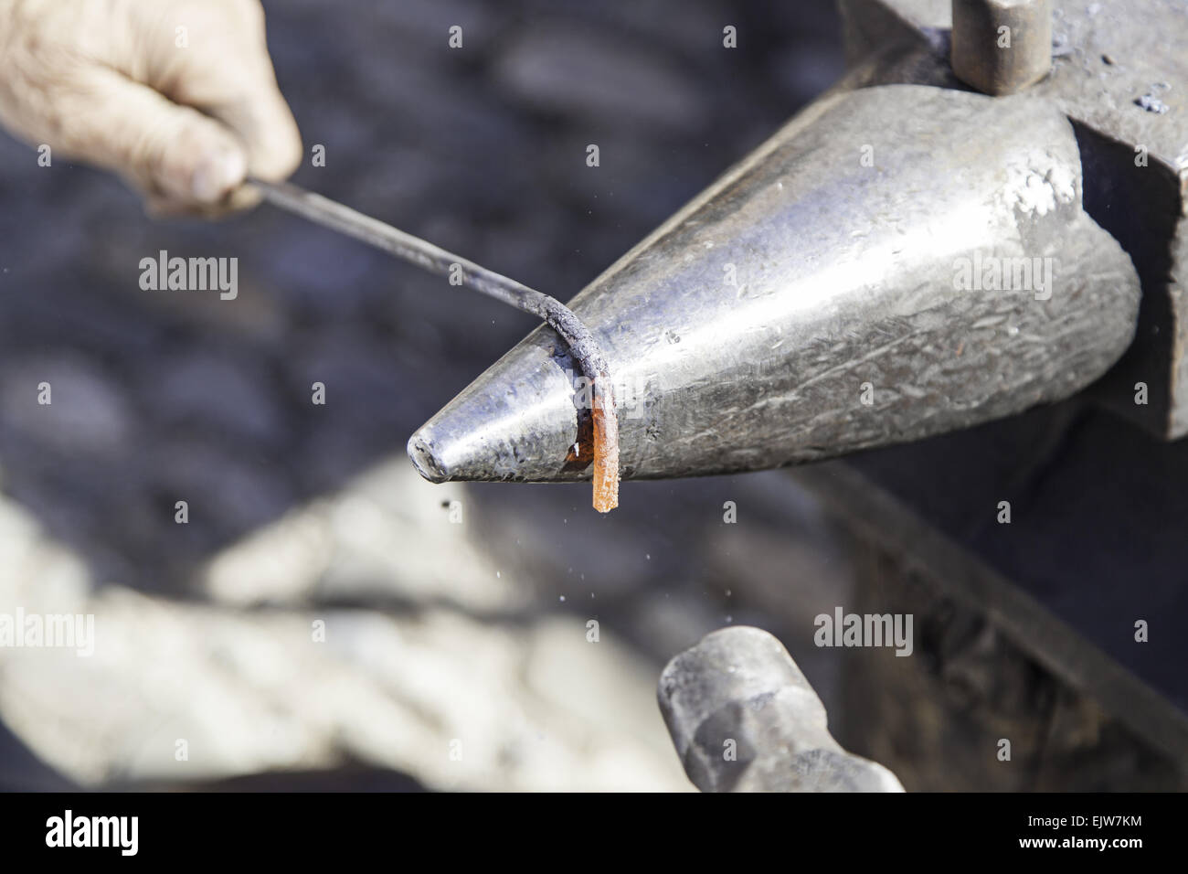 Blacksmith shaping molten metal hammer hi-res stock photography and ...