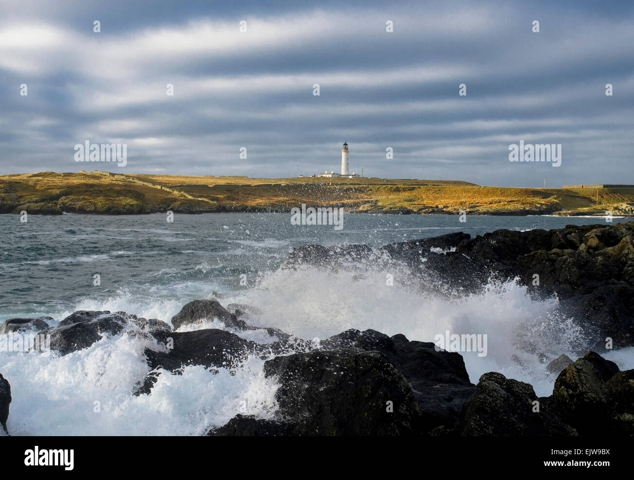 portnahaven lighthouse crashing waves Stock Photo