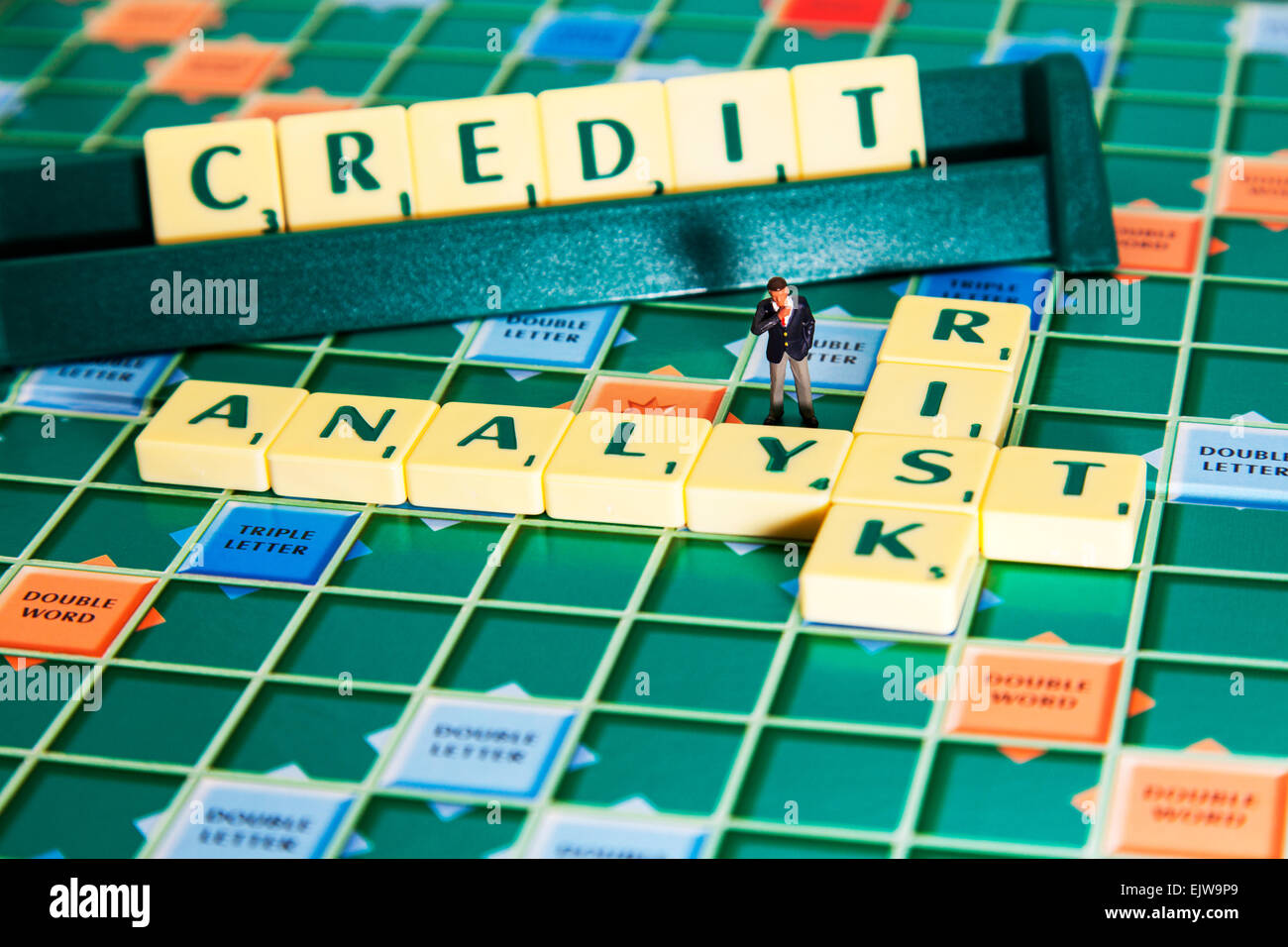 risk analyst calculates the credit creditworthiness of businesses words using scrabble tiles to spell out financial business is Stock Photo