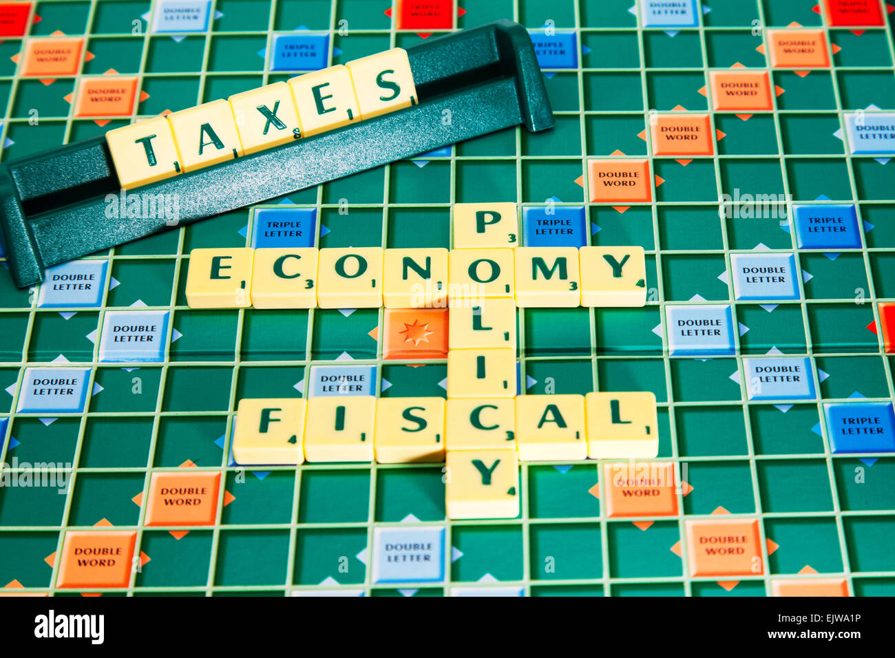 fiscal policy economy taxes tax vat government election words using scrabble tiles to illustrate spelling spell out Stock Photo