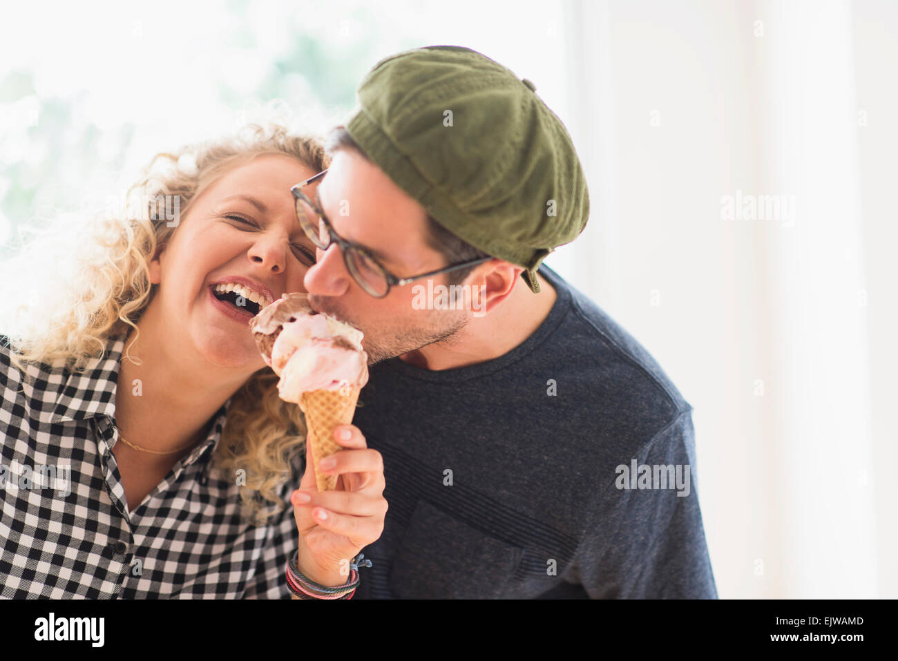 Couple eating ice cream together Stock Photo