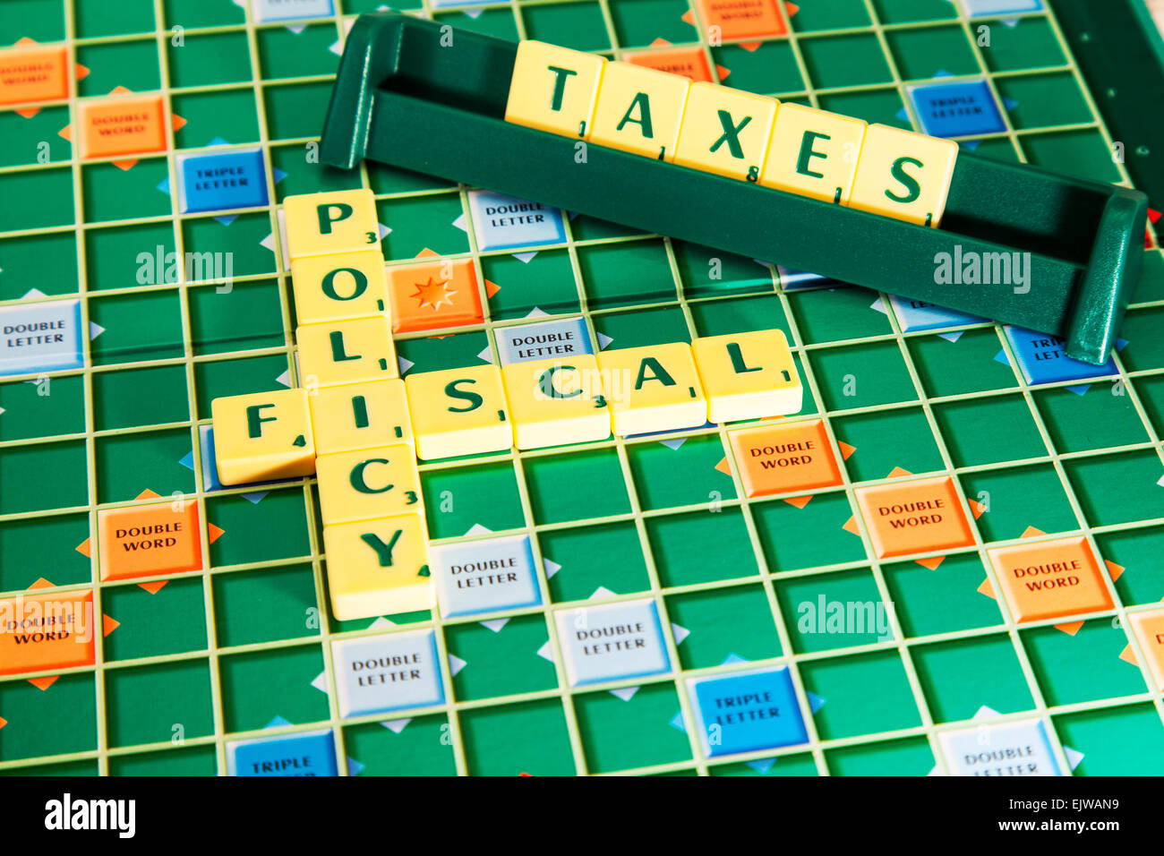 fiscal policy economy government election words using scrabble tiles to illustrate spelling spell out Stock Photo