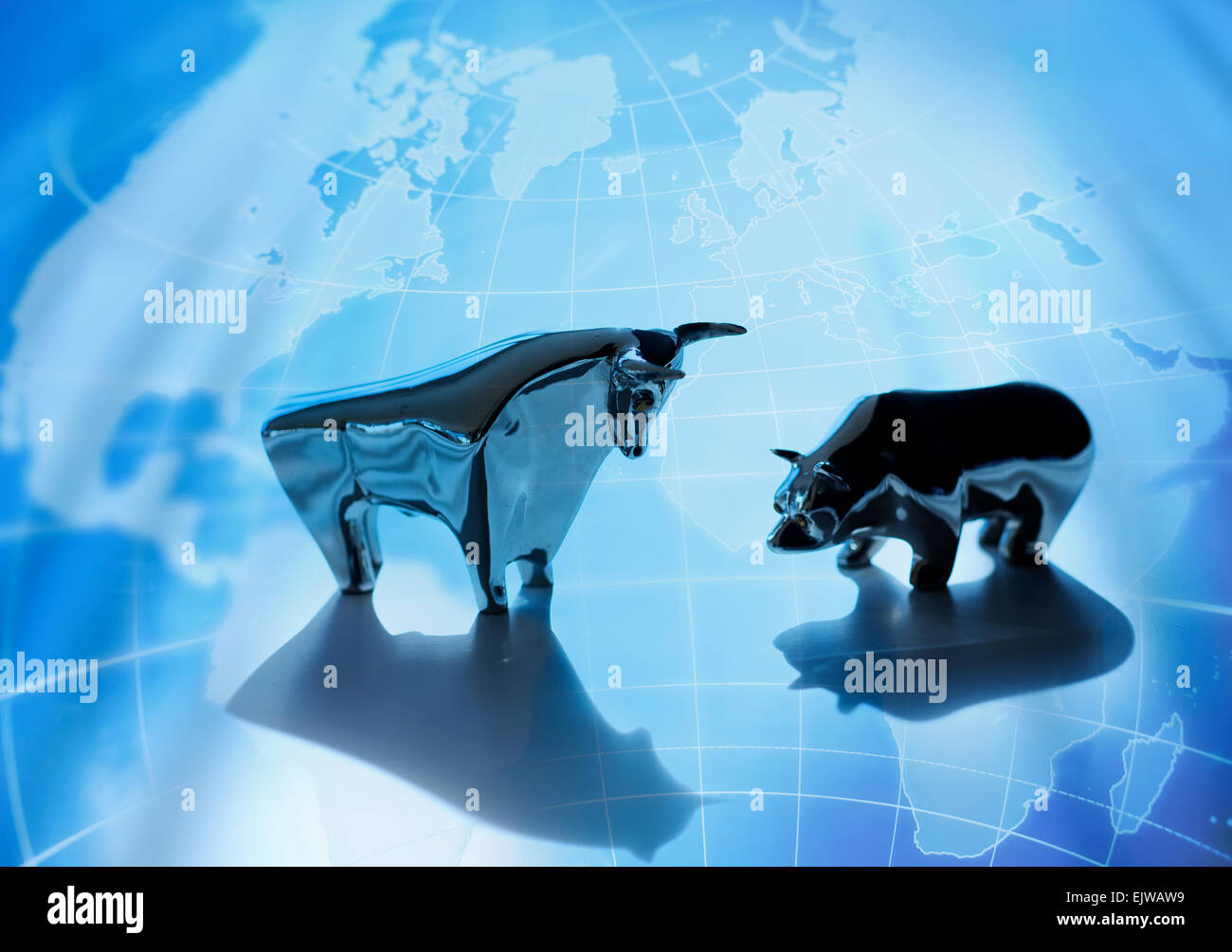 Close up of figurines of bull and bear on world map Stock Photo - Alamy