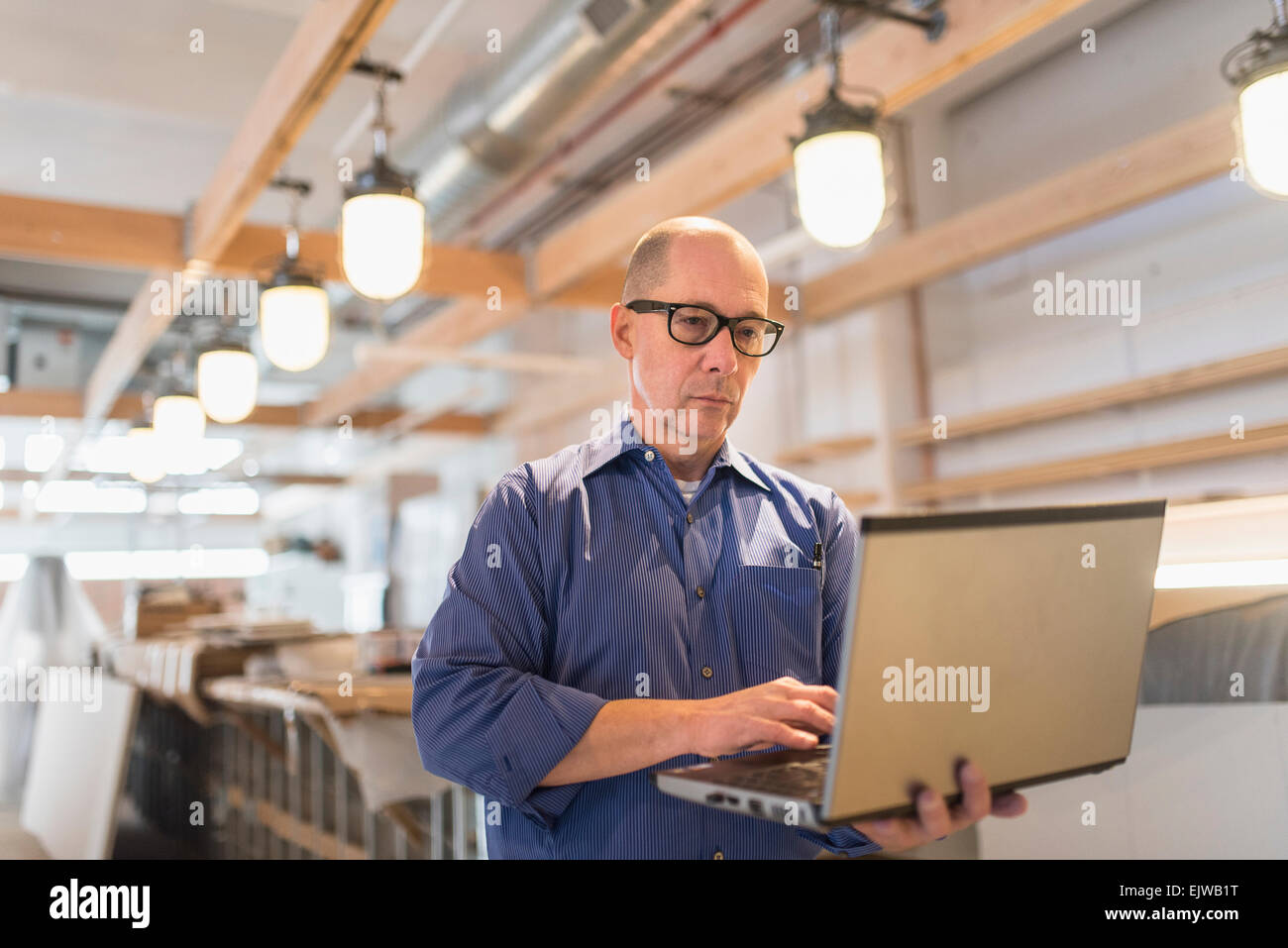 Computer Business Owner Business owner working with laptop Stock Photo - Alamy