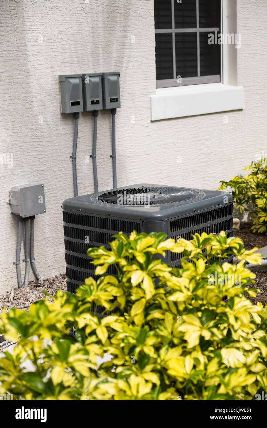 Air conditioning unit in garden Stock Photo Alamy