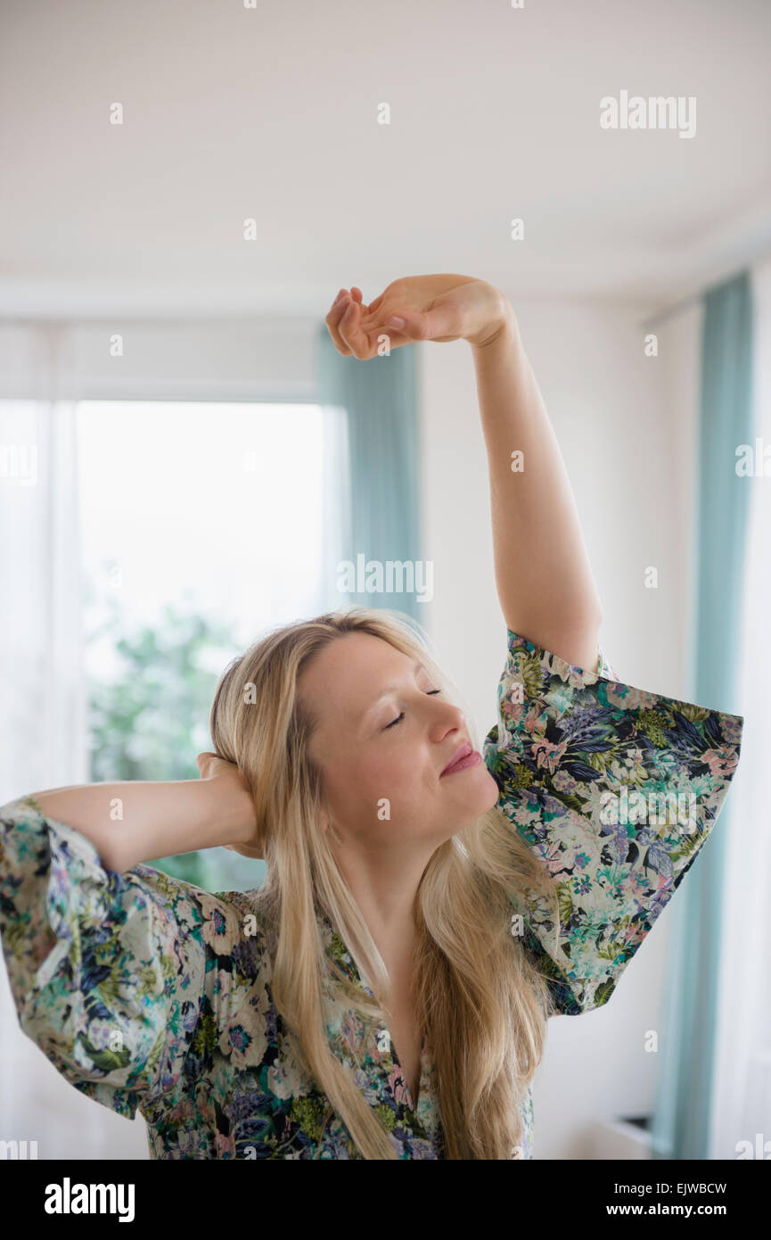 Woman stretching at home hi-res stock photography and images - Alamy