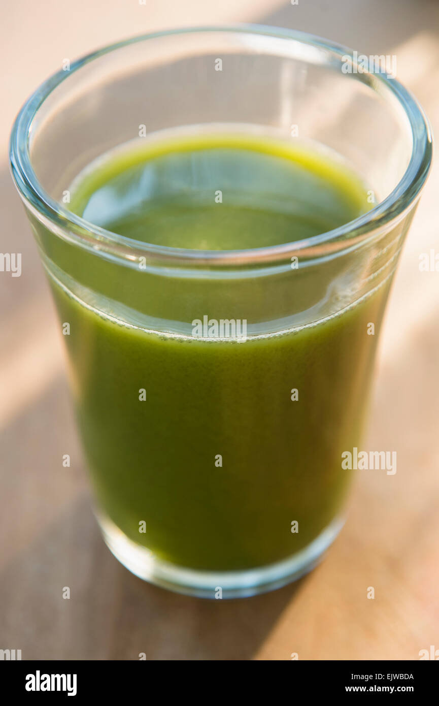 Glass of green juice Stock Photo - Alamy