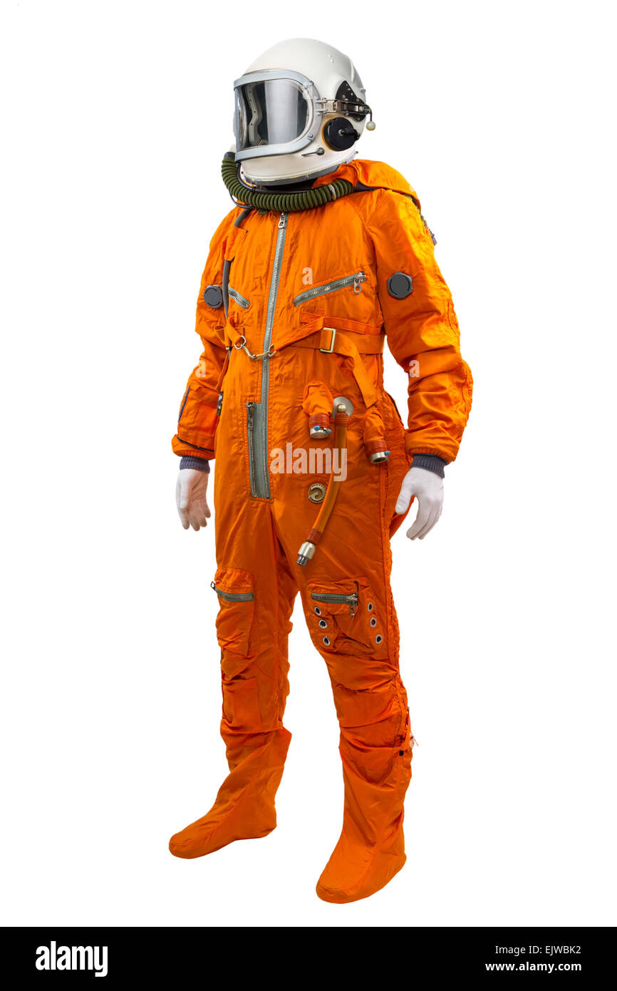 Astronaut wearing space suit standing against white background. Stock Photo