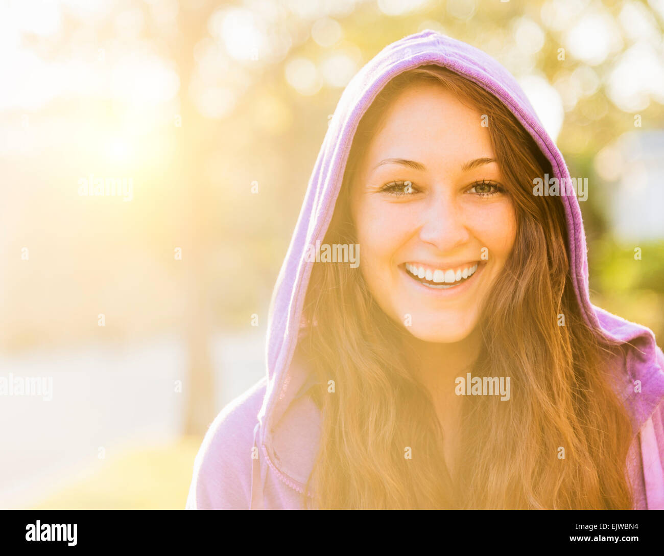USA, Florida, Jupiter, Portrait of smiling woman in hoodie Stock Photo