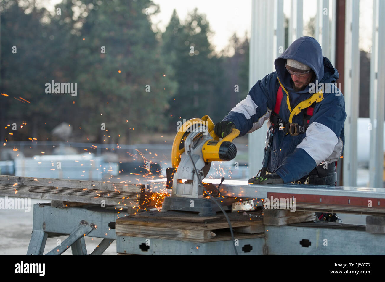 USA, Montana, Kalispell, Man cutting steel bar Stock Photo