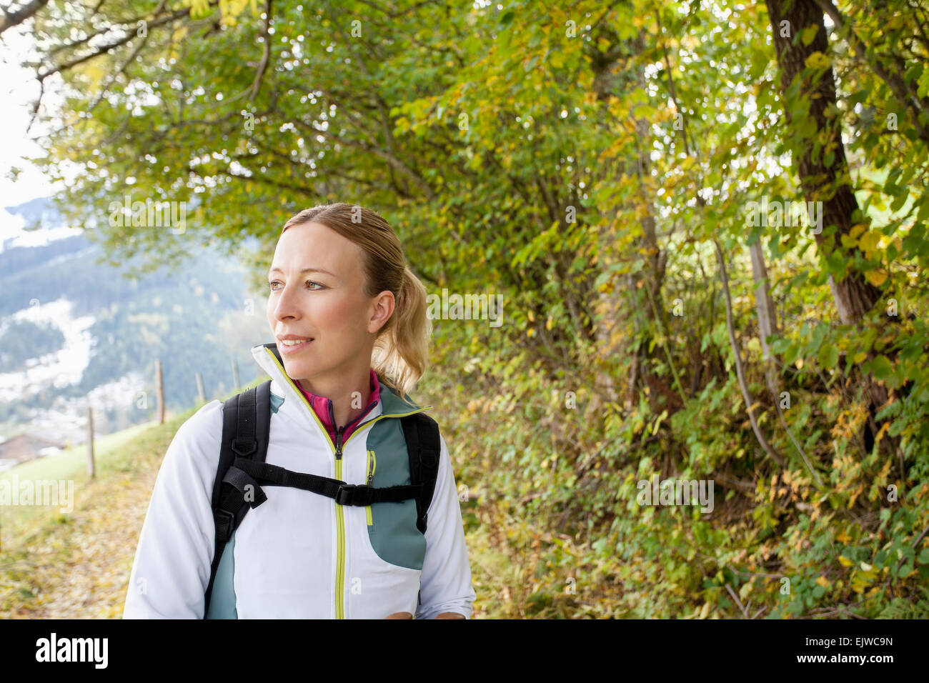 Austria, Salzburger Land, Maria Alm, Woman hiking in mountains Stock Photo