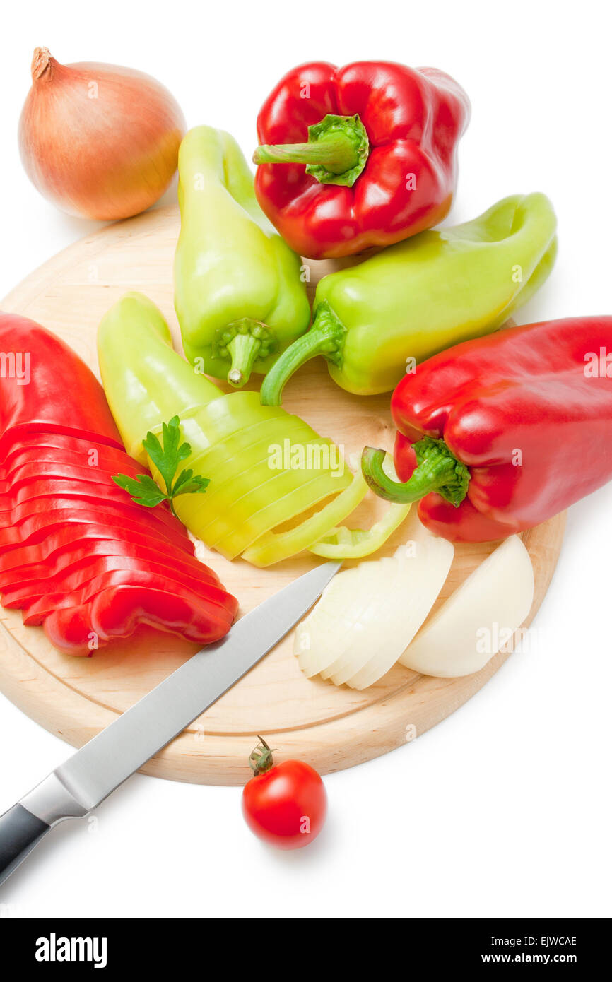 Vegetables and kitchen knife on cutting board Stock Photo