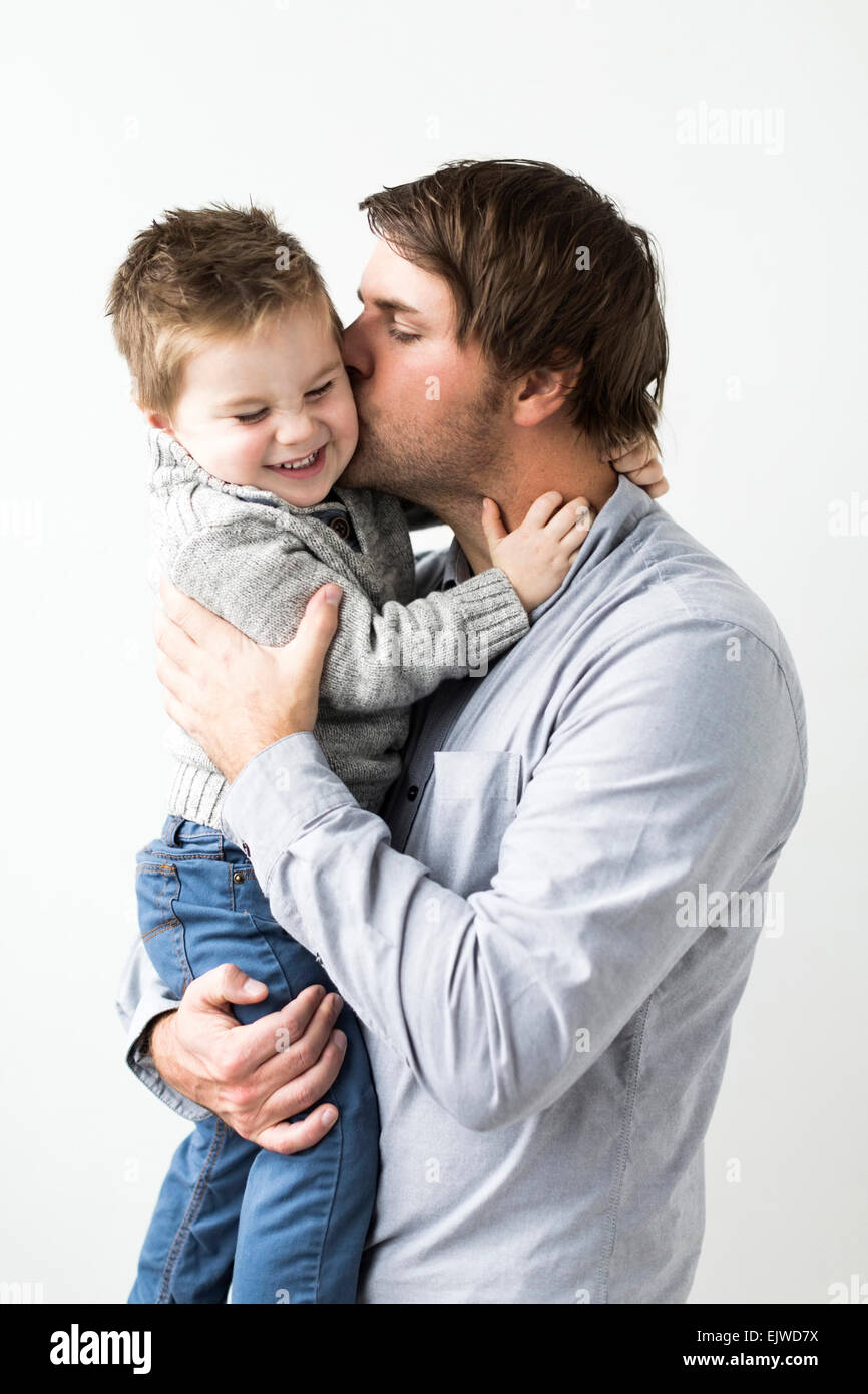 Father kissing son (2-3) Stock Photo