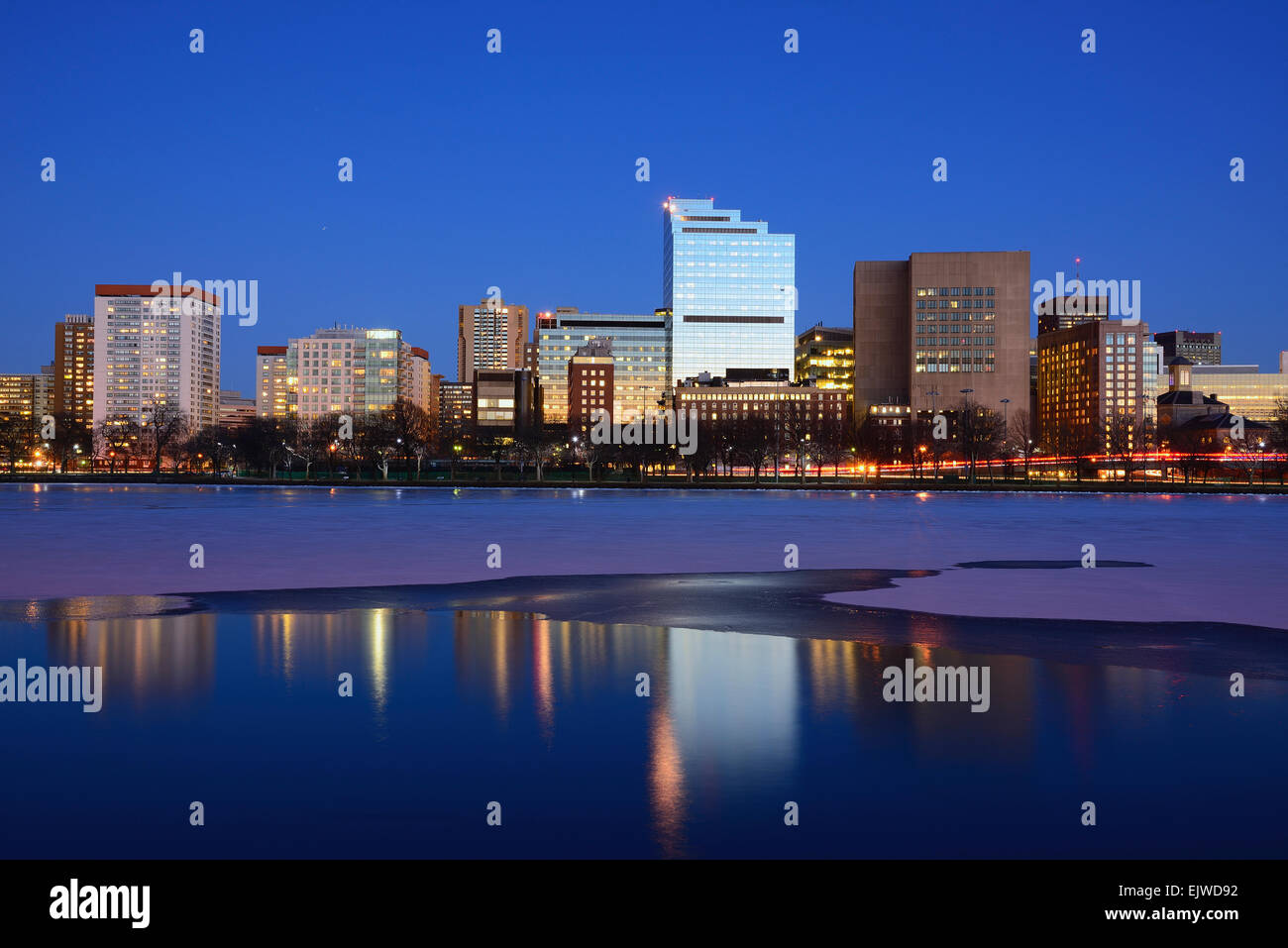 USA, Massachusetts, Boston, Waterfront at dusk, reflection in water ...