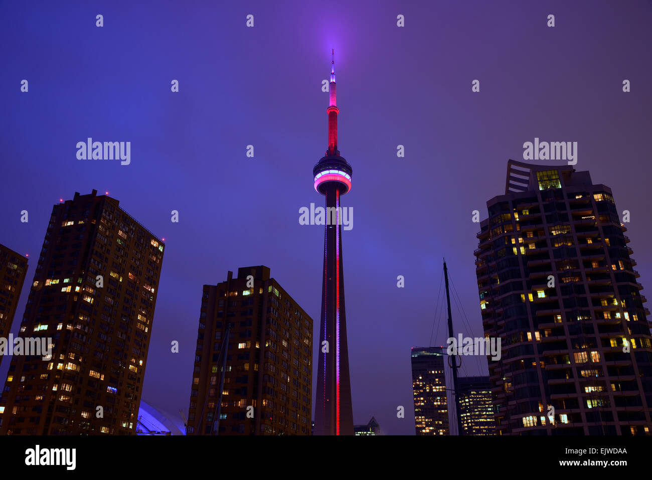 Canada, Toronto, Marina District, Illuminated city at dusk and CN Tower ...