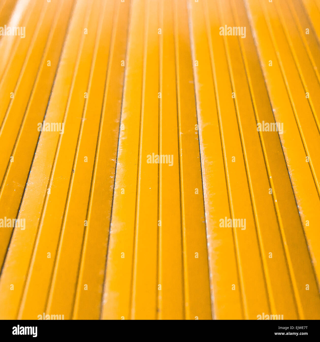 Cross view of yellow metal with shallow depth of field Stock Photo