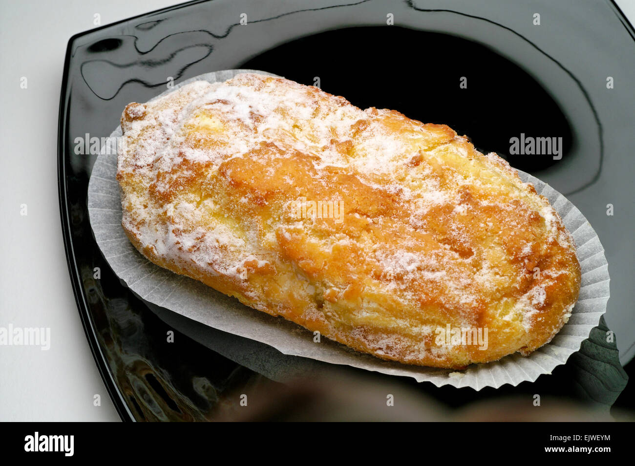 Cream puff pastry on black dish Stock Photo