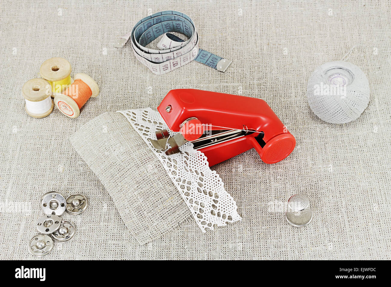 Hand sewing. Portable hand sewing machine "Stitch" products of mass