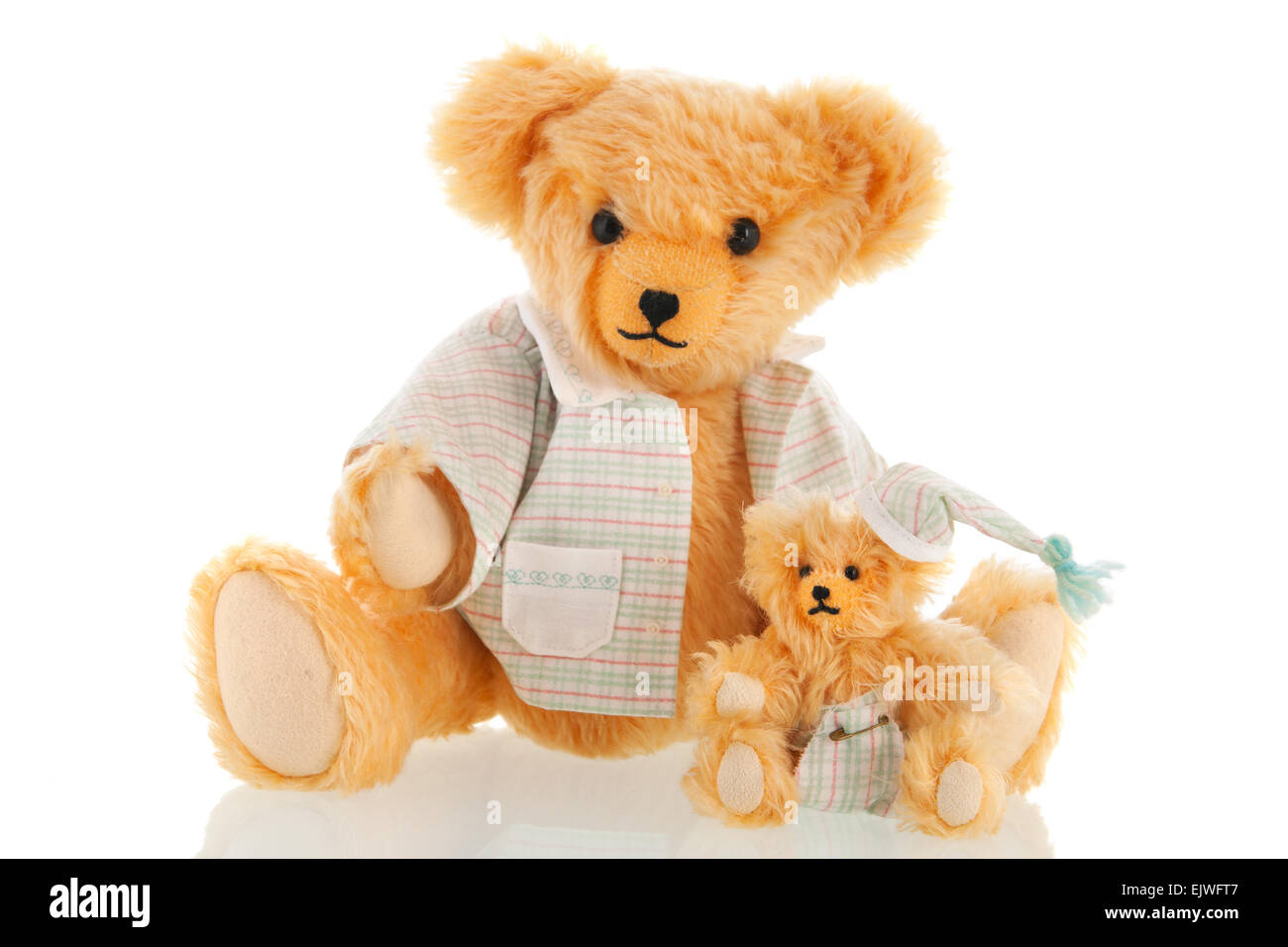 Stuffed bear in pajamas isolated over white background Stock Photo