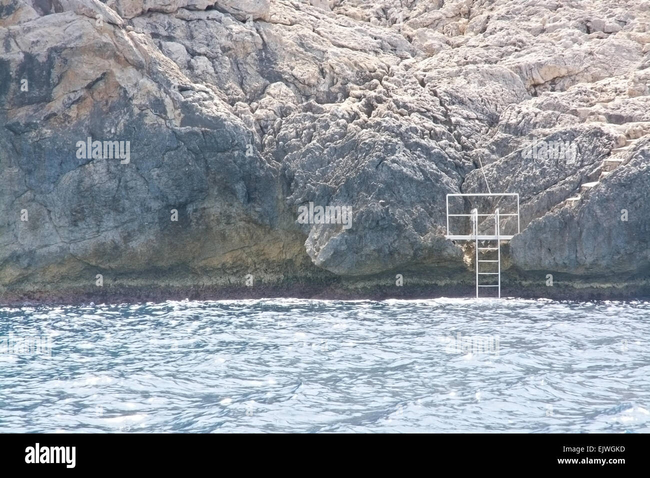 Ladder on a cliff by the coast in July, Mallorca, Balearic islands, Spain. Stock Photo