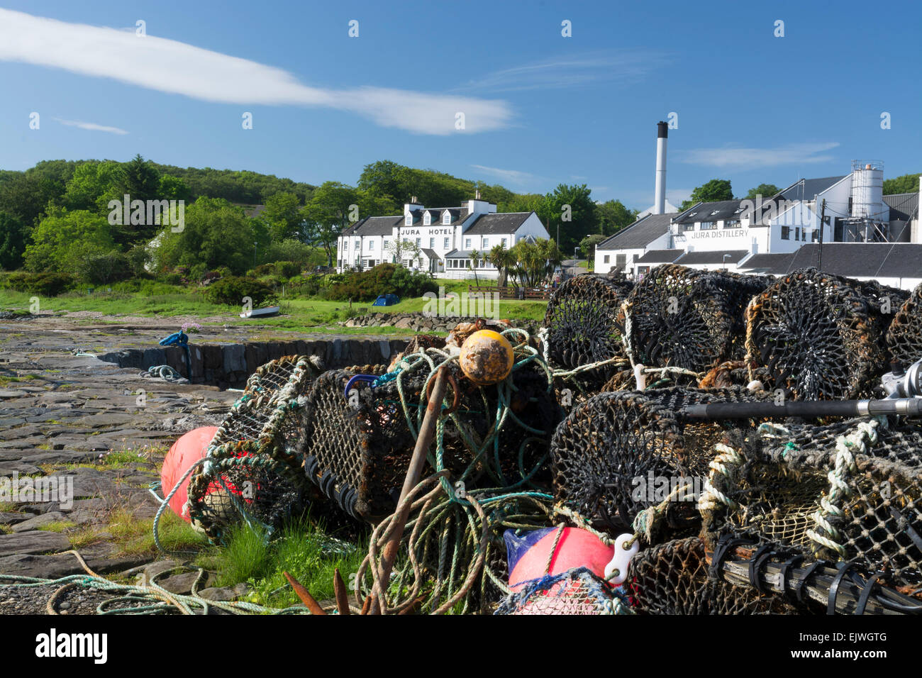 craighouse pier view of distillery creels fishing gear harbour Stock Photo