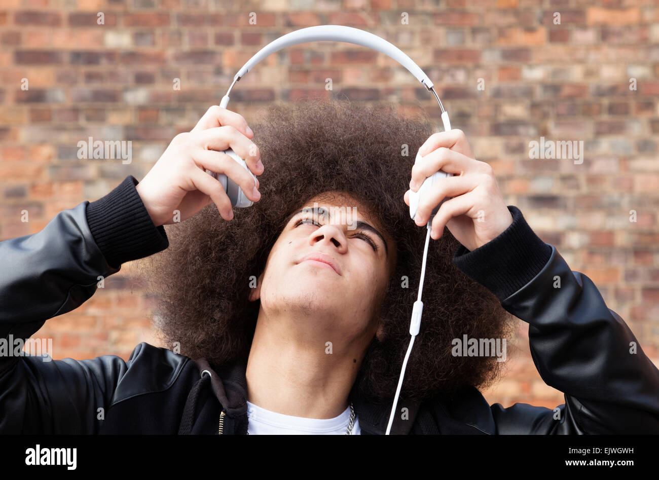 A teenager wearing Dr Dre Beats headphones. Stock Photo