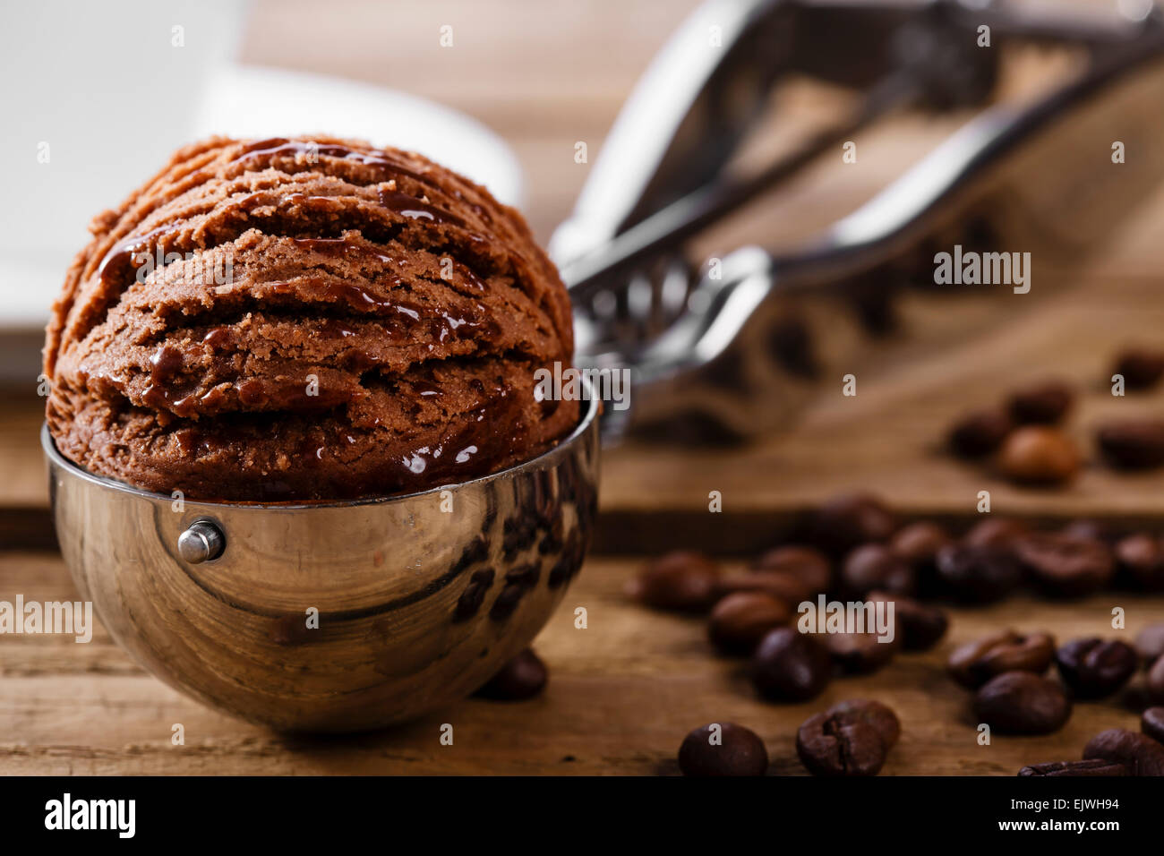 Chocolate coffee ice cream ball scoop spoon Stock Photo Alamy