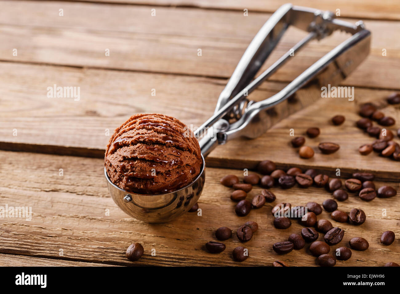 Chocolate coffee ice cream ball scoop spoon Stock Photo