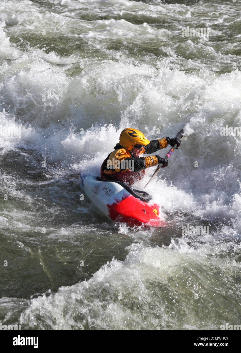 Kayak faces rapids in the Colorado River in Glenwood Canyon Stock Photo