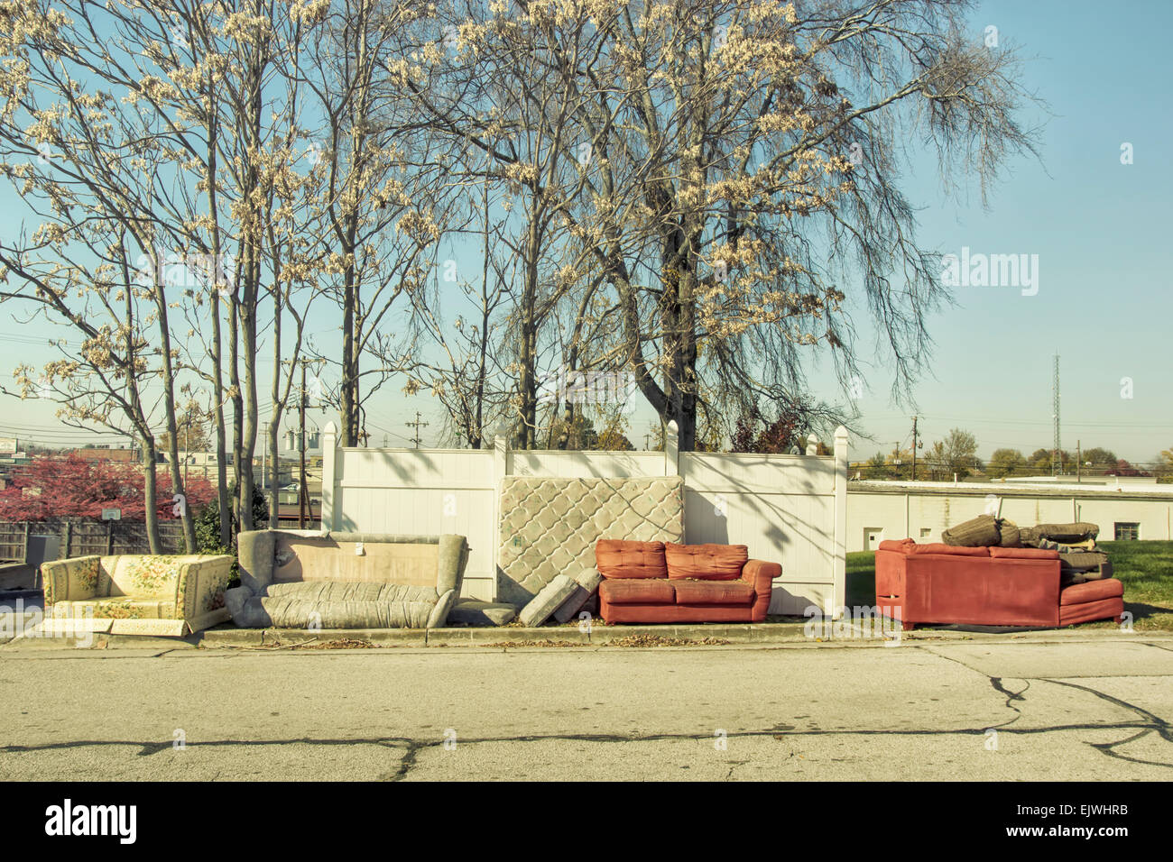 A selection of discarded furnishes sitting next to the road. Stock Photo