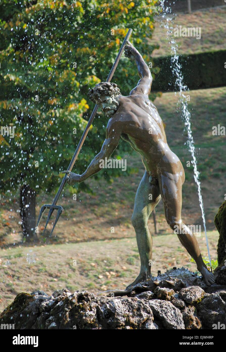 Statue of Neptune with trident in fountain, Boboli Gardens Sculpture Park, Florence, Italy. Stock Photo