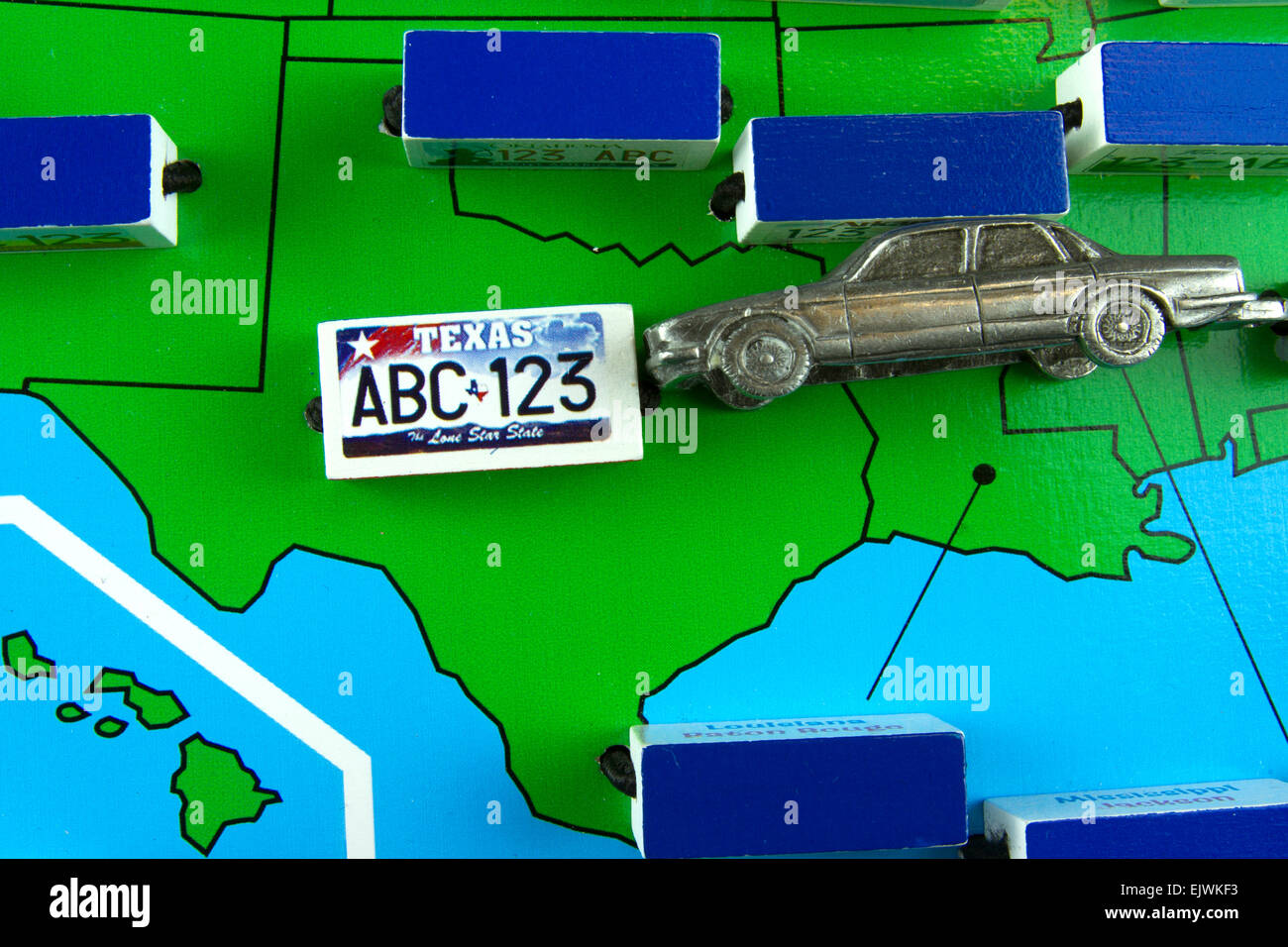New Cumberland, PA, USA - April 1, 2015 : Map of the state of Texas with license plates and a model car Stock Photo