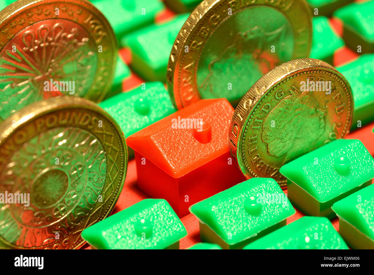 monopoly houses, hotel & coins, Investment property concept Stock Photo