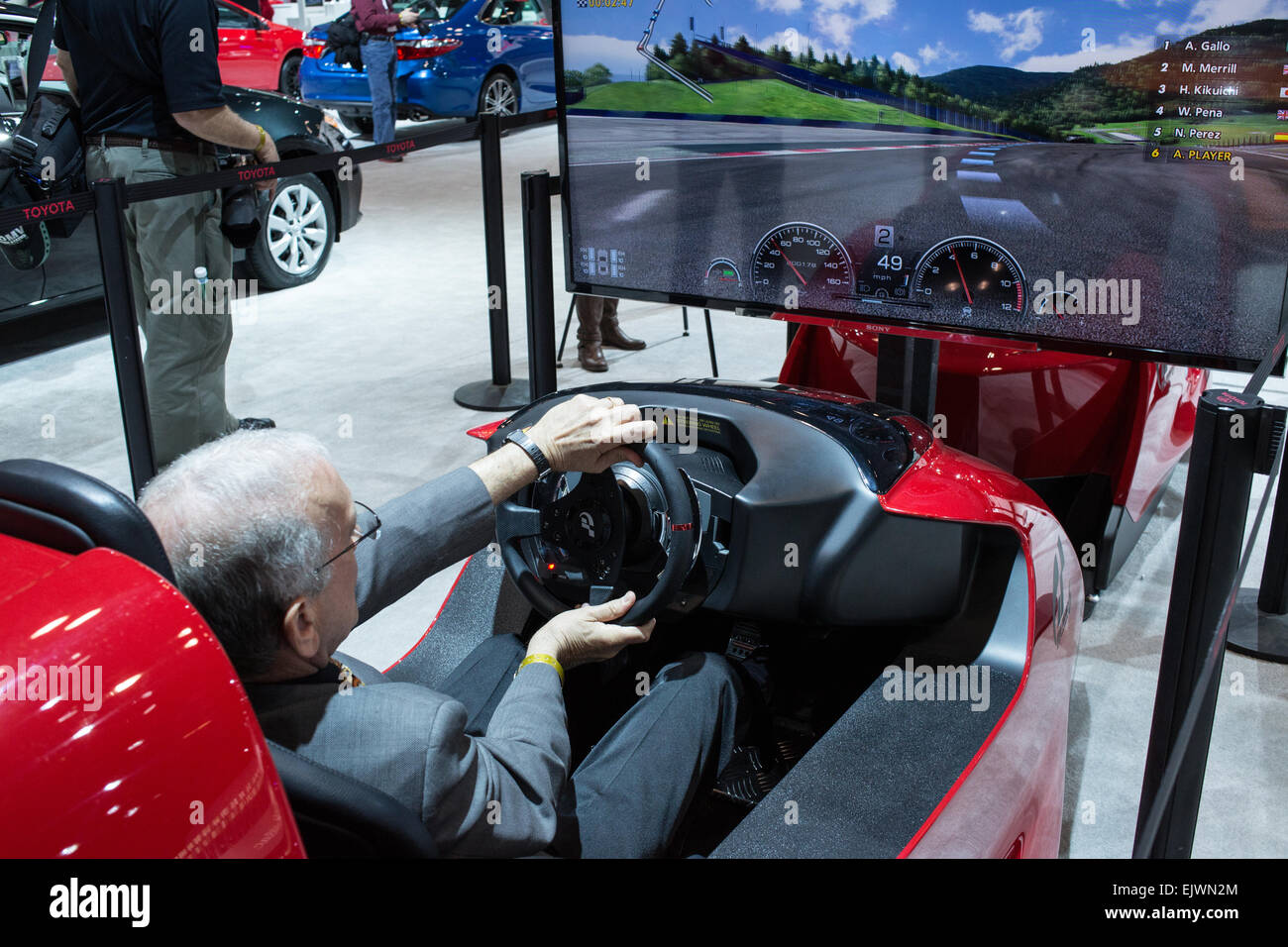 New York, NY - 1 April 2015. A visitor to the New York International Auto Show tries driving the Toytoa FT-1 simulator. The FT-1 is a concept car designed for track use. Credit:  Ed Lefkowicz/Alamy Live News Stock Photo