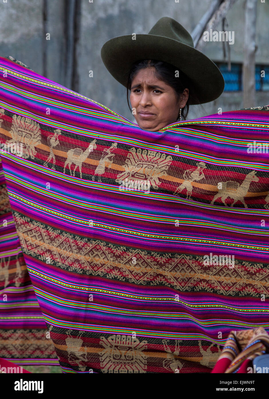 Peru, Urubamba Valley.  Quechua Woman Selling Fabric. Stock Photo