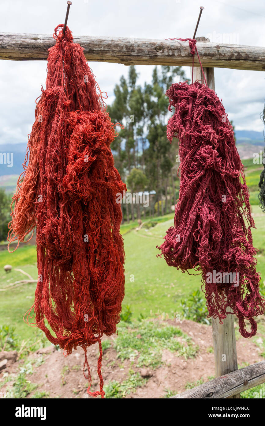 Peru, Urubamba Valley, Quechua Village of Misminay.  Dyed Yarn Drying in the Sun. Stock Photo