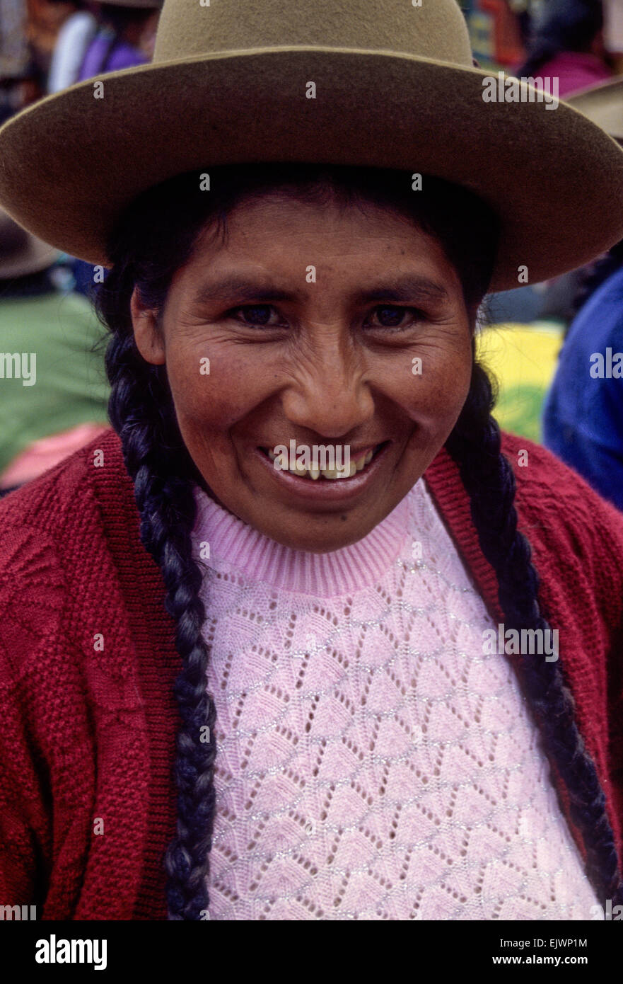 Peru, Pisac.  Quechua Woman in Hat and Pigtails. Stock Photo