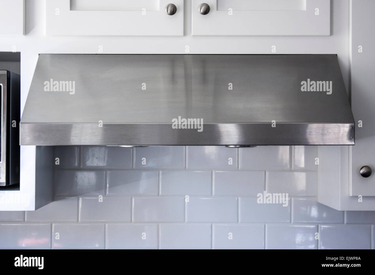 Modern aluminum kitchen range or stove hood Stock Photo