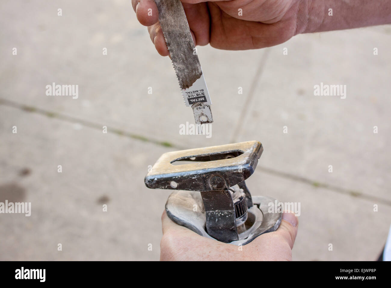 Blade being inserted into reciprocating saw. Sawzall Stock Photo Alamy