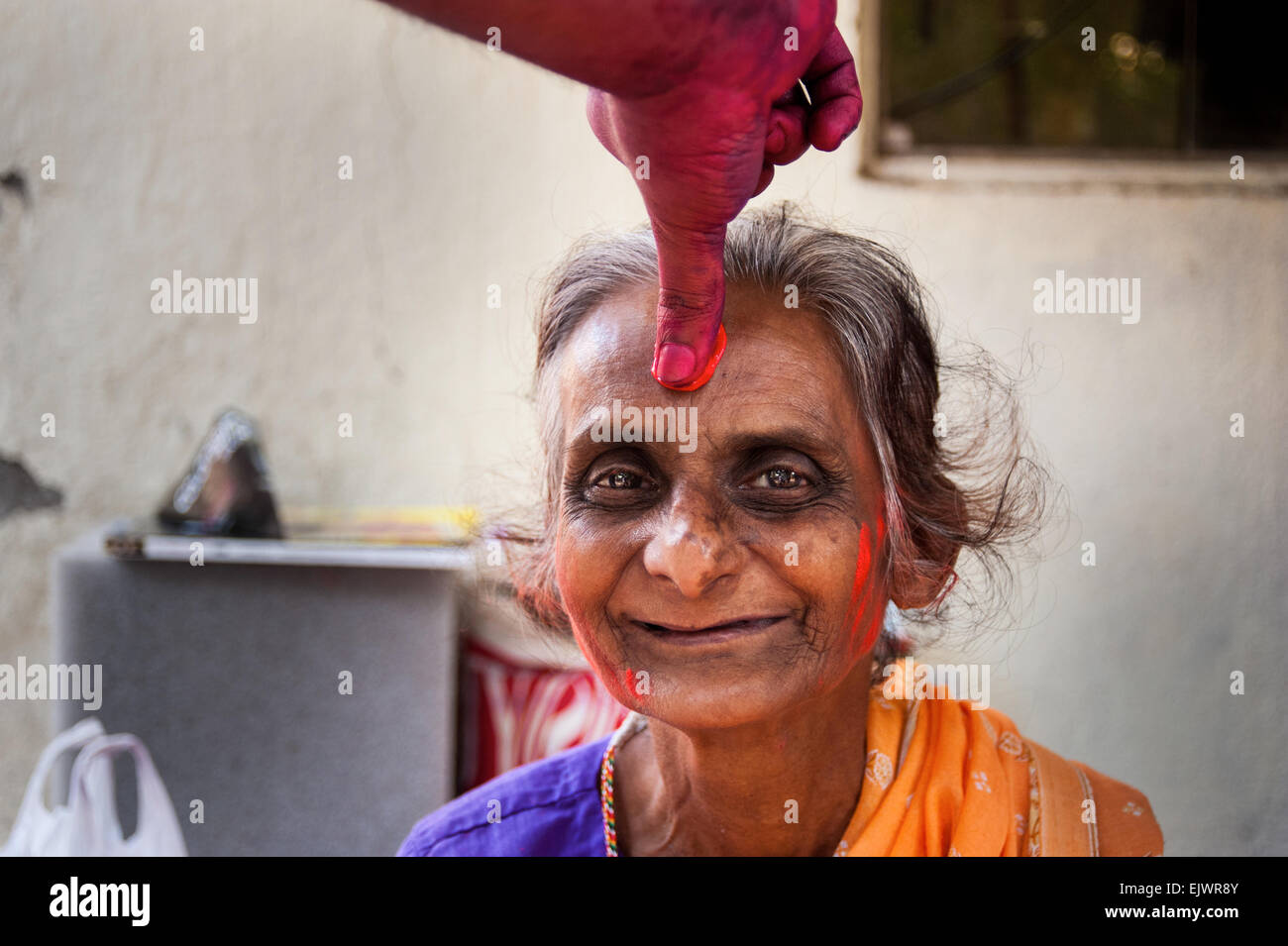 Playing Holi in Mumbai India. Holi also known as the festival of colors