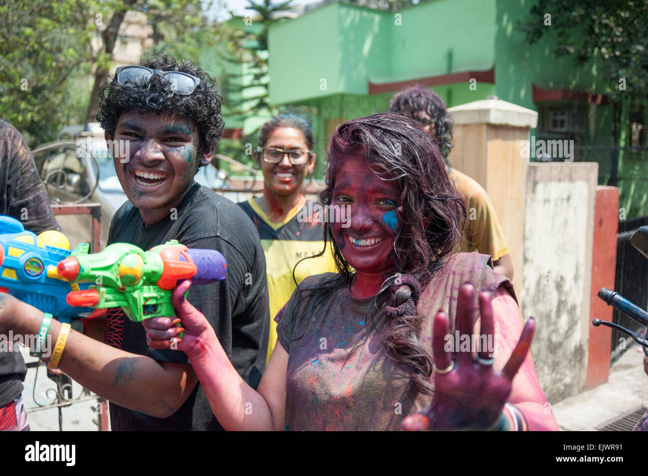 Playing Holi in Mumbai India. Holi also known as the festival of colors