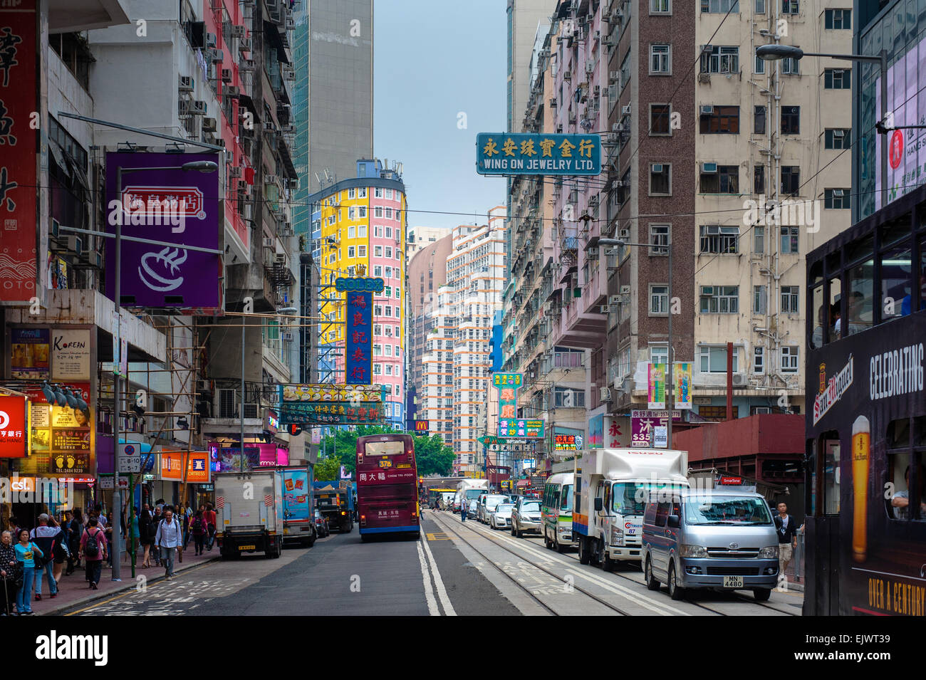 Street view of Johnson road outside the A3 MTR exit looking toward Wan Chai Road. Wan Chai is a beautiful mix of old and new and Stock Photo