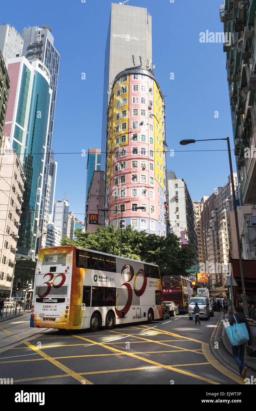 A bus on the streets of Hong Kong Wan Chai area. Hong Kong has a very efficient and inexpensive mass transit system. Stock Photo