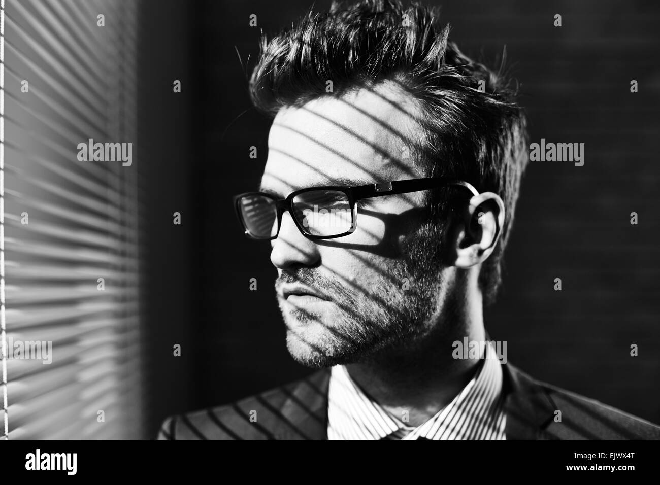 Serious young businessman in eyeglasses Stock Photo
