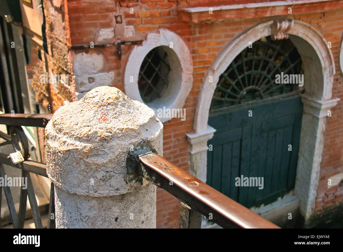 Railings of the old bridge over a canal in Venice, Italy Stock Photo ...